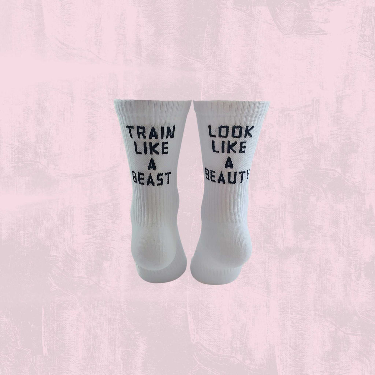 Women’s crew socks with "TRAIN LIKE A BEAST LOOK LIKE A BEAUTY" quote for confident gym workouts