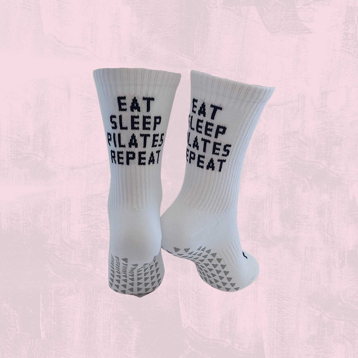 EAT SLEEP PILATES REPEAT text with Pilates grip socks for non-slip stability and confident workouts